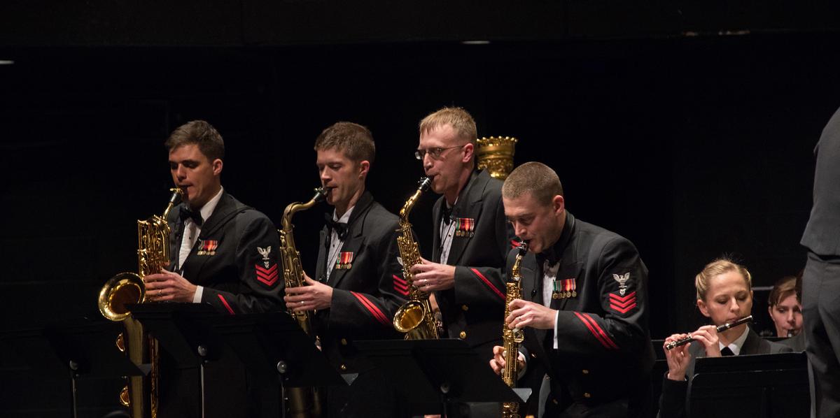 alto vs tenor sax four men playing saxophone